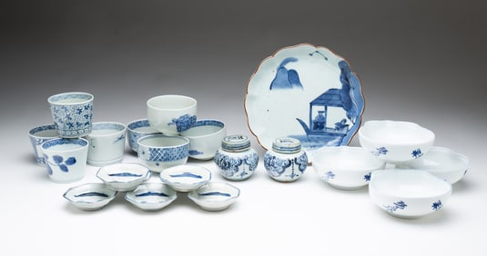 GROUP OF TWENTY-TWO CHINESE AND JAPANESE BLUE AND WHITE PORCELAIN DISHES.