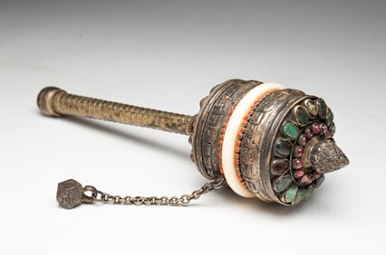TIBETAN WHITE METAL AND HARDSTONE PRAYER WHEEL.