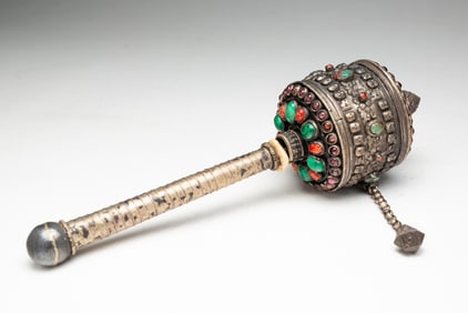TIBETAN WHITE METAL AND HARDSTONE PRAYER WHEEL.