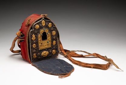 TIBETAN METAL AND PARTIAL GILT GAU TRAVELING SHRINE IN CLOTH POUCH.
