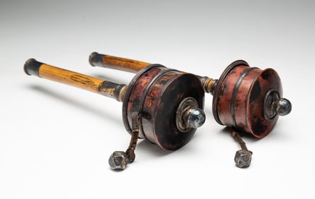 TWO TIBETAN METAL AND WOOD PRAYER WHEELS.