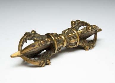 A TIBETAN BRASS VAJRA.