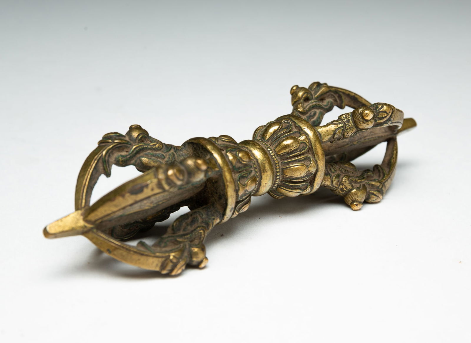 A TIBETAN BRASS VAJRA. (1 of 7)