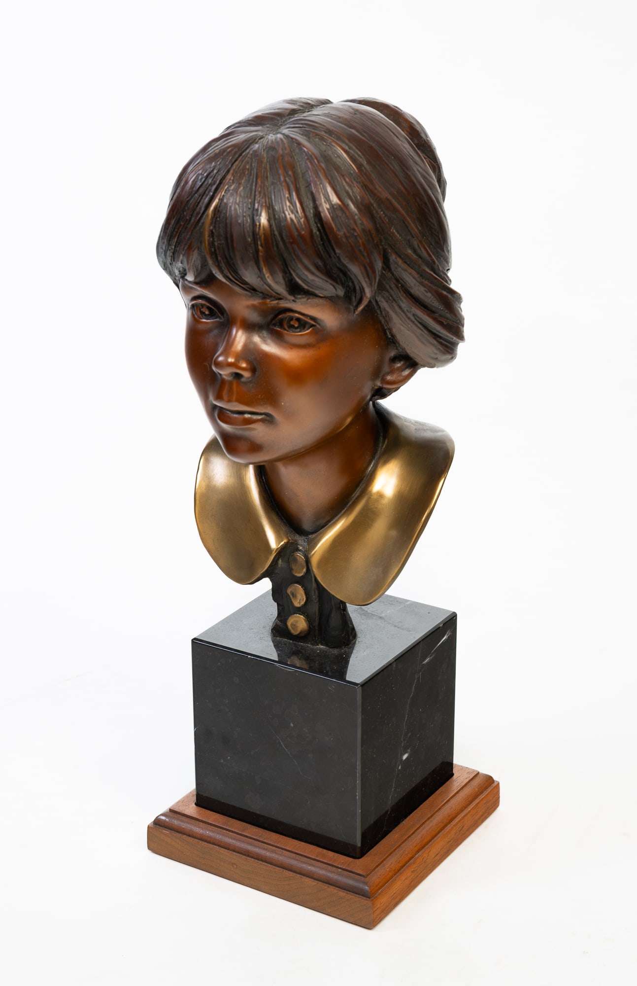 GEORGE LUNDEEN (AMERICAN, B. 1948) "ERICA STUDY #2" BRONZE BUST OF A YOUNG WOMAN. (1 of 4)