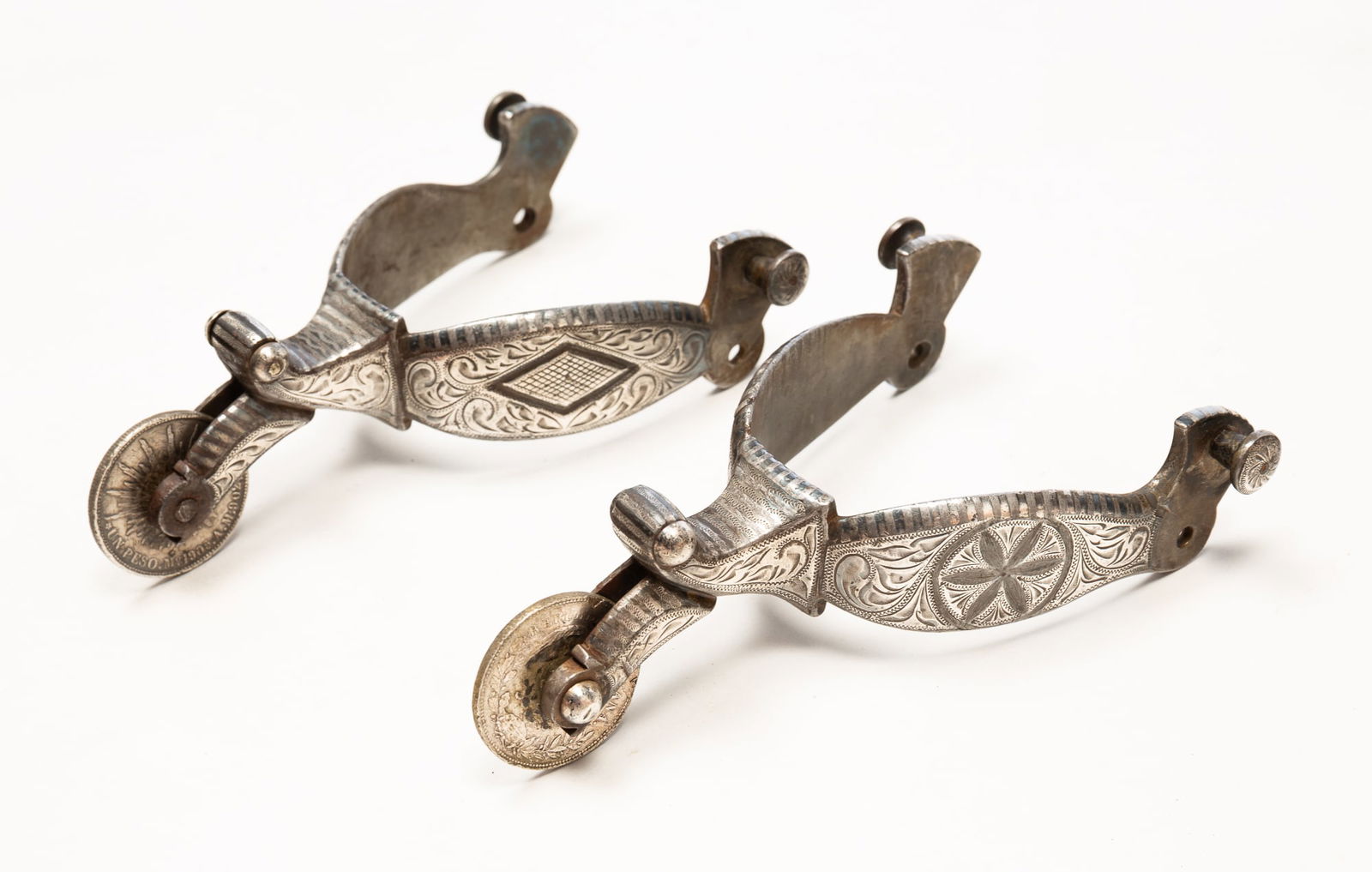 A BEAUTIFUL PAIR OF MEXICAN SILVER INLAID SPURS. (1 of 5)