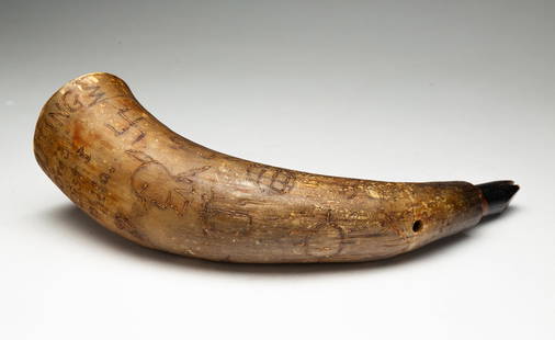 PHILADELPHIA CARVED HUNTING HORN WITH NATIVE AMERICAN MOTIFS.: American (Philadelphia, Pennsylvania), ca.1900. A hunting horn with open end, duck call to tip, and engraved decoration. Engraved with Native American imagery and "Scouting 176 '10' to '31' Dist. 1 Ph