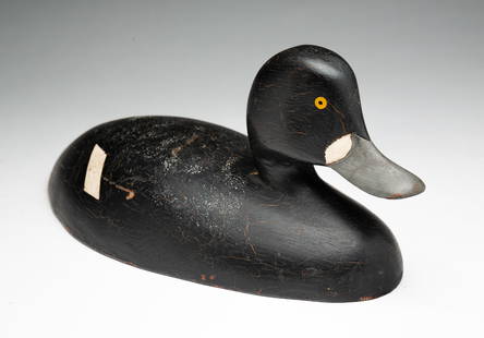 HOLLOW CARVED BLUEBILL HEN DUCK DECOY ATTRIBUTED TO RAY POMEROY.: American, 20th Century. Carved and painted wood duck with inscription on underside attributing decoy to Ray Pomeroy, with original paint. 4.5"h. 5"w. 11"l. Sold at Guyette & Schmidt (Michaels, Marylan
