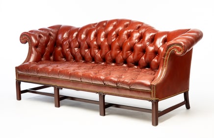 CHIPPENDALE STYLE BUTTONED-DOWN LEATHER CAMELBACK SOFA WITH BRASS TACKS.