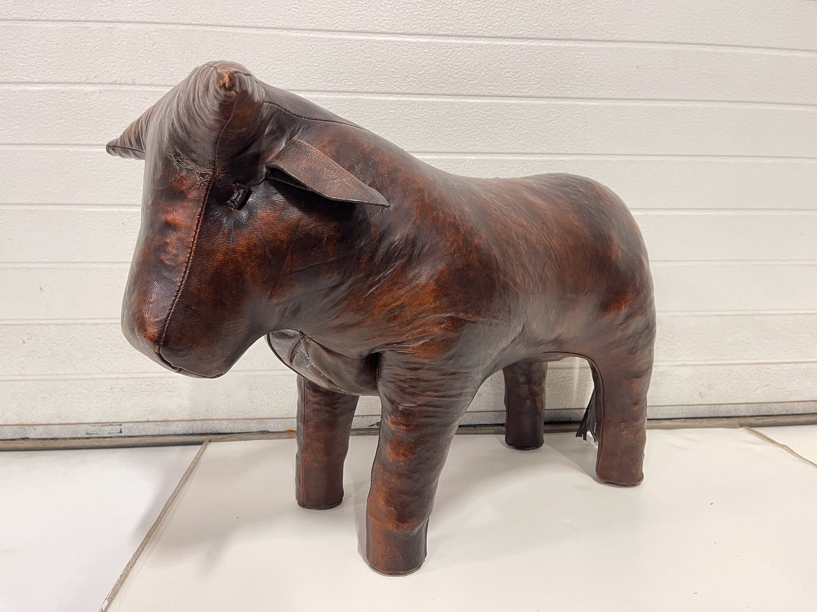 MANNER OF DIMITRI OMERSA (YUGOSLAVIAN-ENGLISH, 1927-1975) FOR ABERCROMBIE & FITCH LEATHER BULL: Manner of Dimitri Omersa (Yugoslavian-English, 1927-1975). Brown leather, button eyes and heavy stitched seams. 17"h.