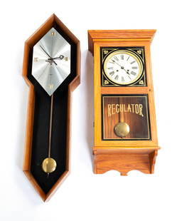 HOWARD MILLER MID CENTURY MODERN WALNUT AND BRUSHED ALUMINUM WALL CLOCK PLUS EMPEROR OAK REGULATOR.: American, 20th Century. The first having a long, ten-sided walnut case with a brushed aluminum dial and brass pendulum, with brass works and a key. The dial is marked "HOWARD MILLER" with additional l