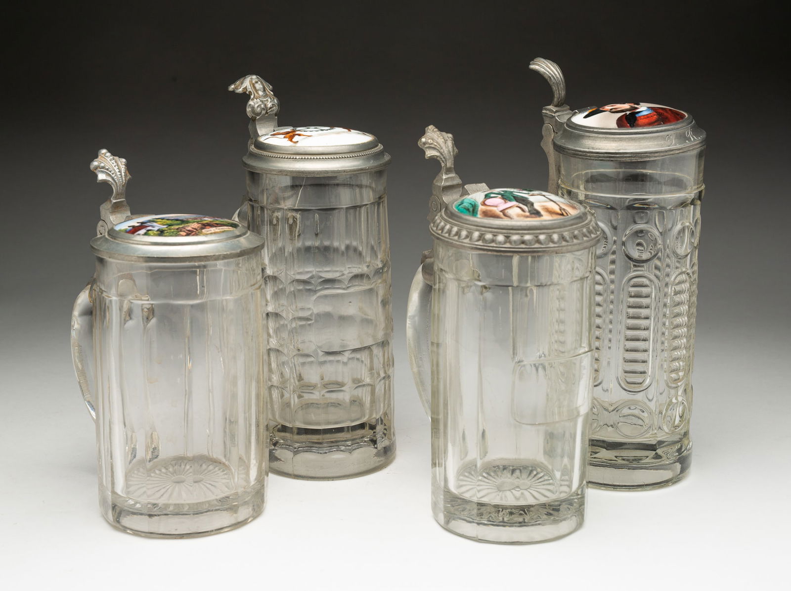 FOUR GERMAN CUT GLASS BEER STEINS. (1 of 6)