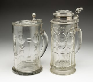TWO GERMAN GLASS BEER STEINS.