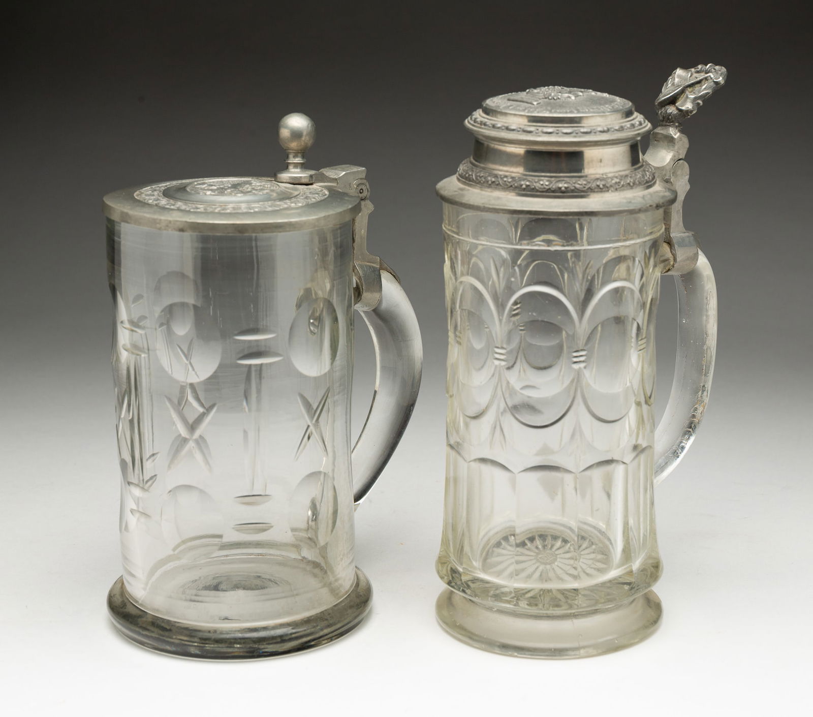 TWO GERMAN GLASS BEER STEINS.