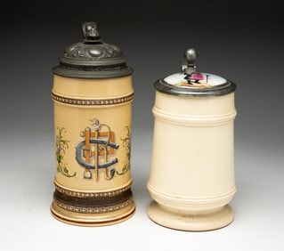 TWO GERMAN CERAMIC BEER STEINS.