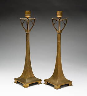 ATTRIBUTED TO CURT STOEVING (GERMAN, 1863-1939), PAIR OF ART NOUVEAU PATINATED BRONZE CANDLESTICKS.: Attributed to Curt Stoeving (German, 1863-1939), ca. 1900. Having screw-in candle cups on circular bobeches over branching forms, slender four-sided columns tapering into a square base raised on four