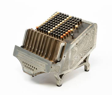 AMERICAN BRANDT AUTOMATIC CASHIER.: American (Watertown, Wisconsin), ca.1900. White metal. Nicely cast with good detail, nine coin slots and multiple change combinations. 11"h. 10.75"w. 14"d.