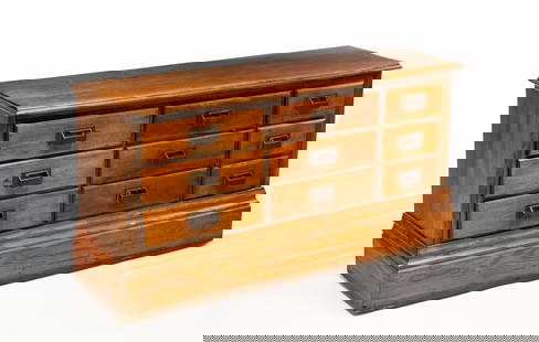 AMERICAN CASE OF DRAWERS.: American, ca. 1900, Maple with pine secondary. Top with routed edge, solid ends, simple base moldings, and nine drawers with copper pulls. 25.25"h. 48.5"w. 14.5"d. Assembled from old parts.