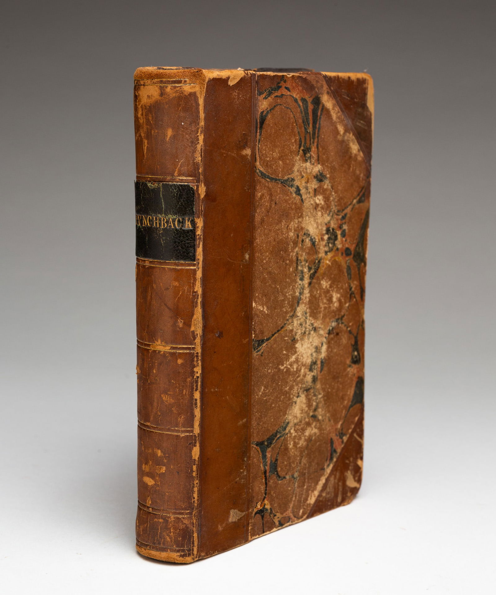 VICTOR HUGO (FRENCH, 1802-1885) "THE HUNCHBACK OF NOTRE DAME": London, England, Mid-19th Century. Leather bound and marble cover. Published by Thomas Hodgson, 13, Poternoster Row. Fairly nice condition. 6.5''h. 4.25''w.