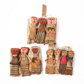 THREE GROUPS OF PERUVIAN CHANCAY CLOTH BURIAL DOLLS ON PANELS.