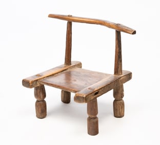 IVORY COAST DIMINUTIVE CARVED WOOD CHAIR.