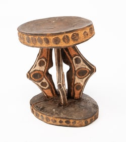 PAPUA NEW GUINEAN CARVED AND PAINTED WOODEN STOOL.