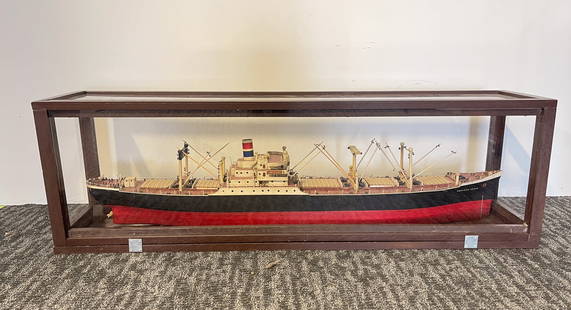 LARGE "AMERICAN SCOUT" CARGO SHIP MODEL WITH DISPLAY CASE.: American, Early 20th Century. A large model of the cargo ship, American Scout. Marked to the stern "American Scout, New York". In a wood and plexiglass case, 16.75"h. 54"w.
