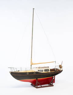 WOOD MODEL SAILBOAT "HANNA D II".: American, 20th Century. Wood. Single masted ship with painted hull, working rudder, cabin with retractable roof and working doors. With stand. 46"h. 36"w.