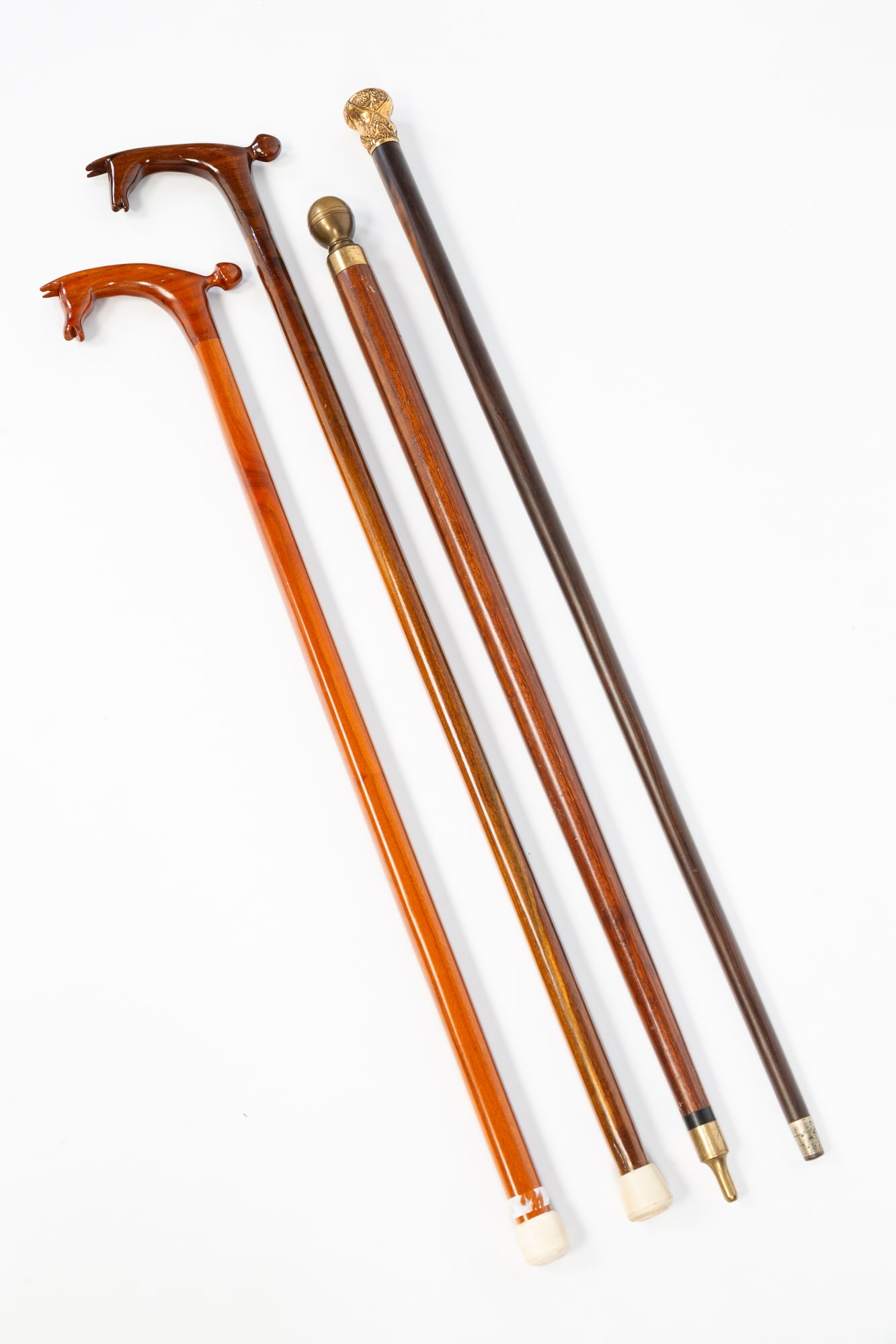 TWO WALKING STICKS AND TWO CANES. (1 of 5)