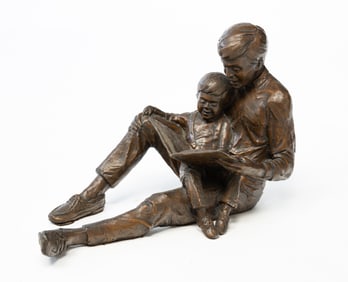 GARY LEE PRICE (AMERICAN, B. 1955) BRONZE SCULPTURE OF FATHER AND CHILD READING.
