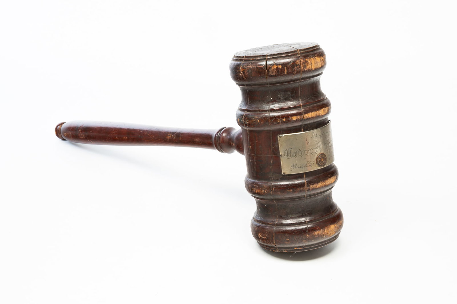 OVERSIZED AMERICAN LEGION PINE GAVEL.: American, 20th Century. Having a turned pine handle and body. With engraved metal plaque reading "Covered wagon / Bristol, R.I. / July 29, 1925" along with an American Legion seal, 46"h. From the coll