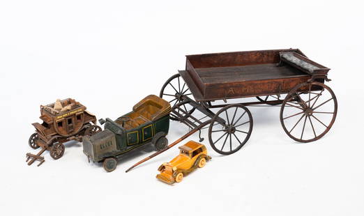 GROUPING OF AMERICAN TRANSPORTATION TOYS.: American, early 20th Century. An A.H. Spiller horse drawn cart toy, 9.75"h. 29"l. A bench-made model car, 3"h. 7.75"w. A wooden pull car with carriage striping and "W.D. 715" to the hood, 5.75"h.11.5"