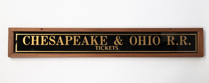 REVERSE PAINTED GLASS CHESAPEAKE AND OHIO RAILROAD TICKET SIGN.