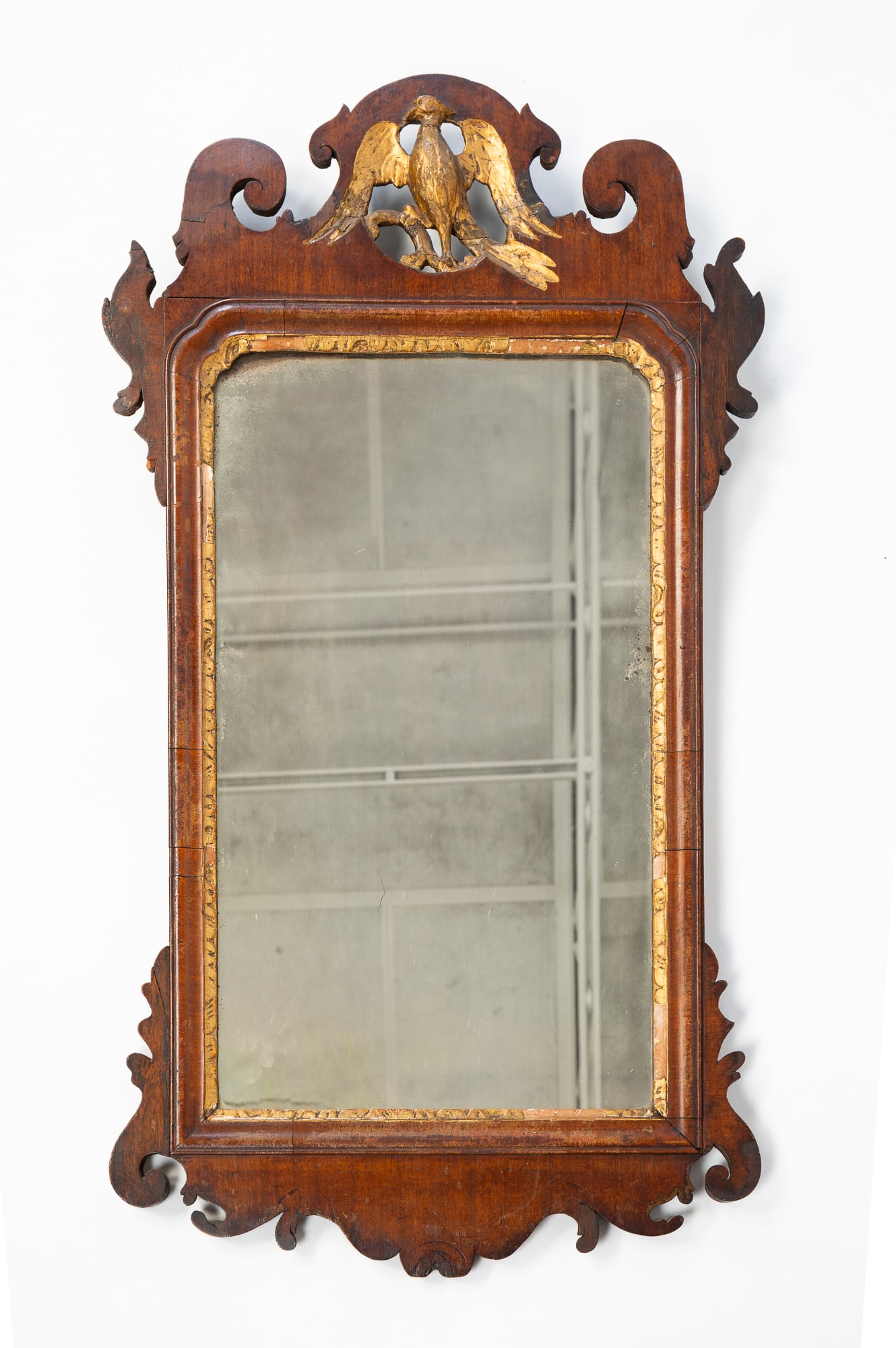 AMERICAN CHIPPENDALE FRET-CARVED MAHOGANY AND PARCEL-GILT MIRROR WITH SPREAD-WINGED EAGLE. (1 of 4)