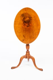 AMERICAN QUEEN ANNE TIGER MAPLE AND BIRCH TILT-TOP CANDLESTAND.