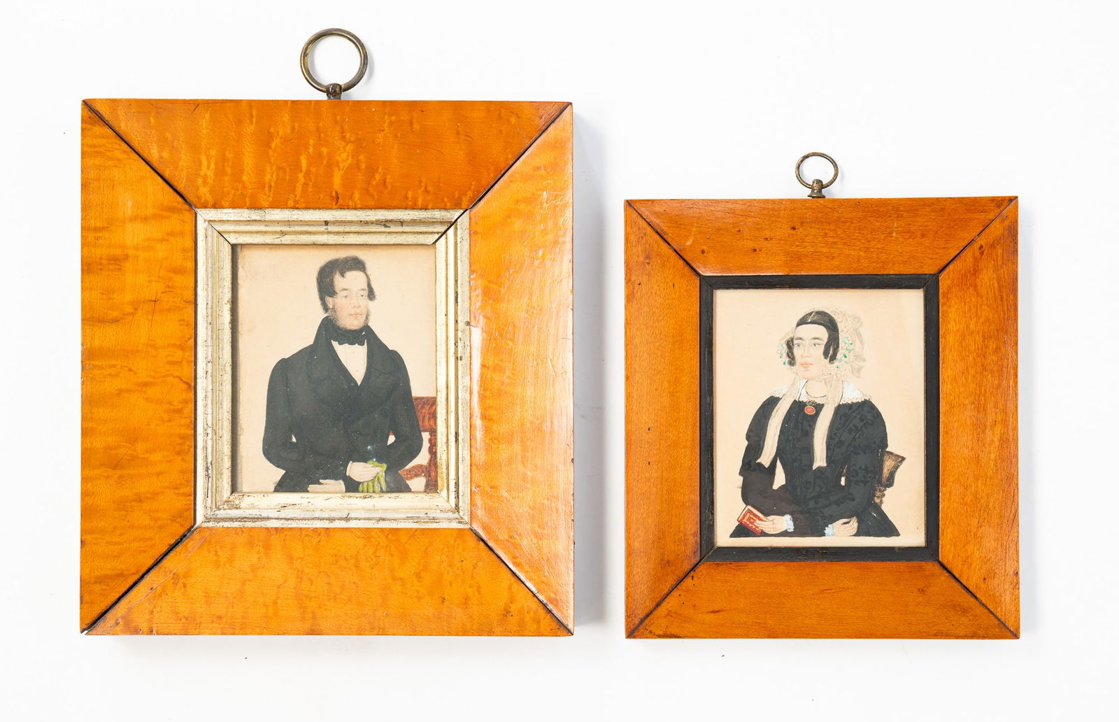 PAIR OF AMERICAN SCHOOL FOLK ART MINIATURE WATERCOLOR PORTRAITS OF A GENTLEMAN AND A LADY. (1 of 4)