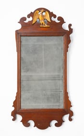 AMERICAN FRET-CARVED MAHOGANY AND PARCEL-GILT MIRROR WITH SPREAD-WINGED EAGLE.