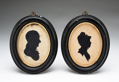 PAIR OF AMERICAN MINIATURE HOLLOW-CUT SILHOUETTES OF A MAN AND WOMAN.