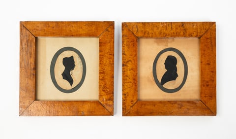 PAIR OF AMERICAN MINIATURE HOLLOW-CUT SILHOUETTE PORTRAITS OF HUSBAND AND WIFE.