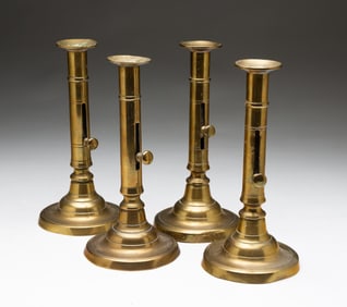 TWO PAIRS OF PUSHUP BRASS CANDLESTICKS.