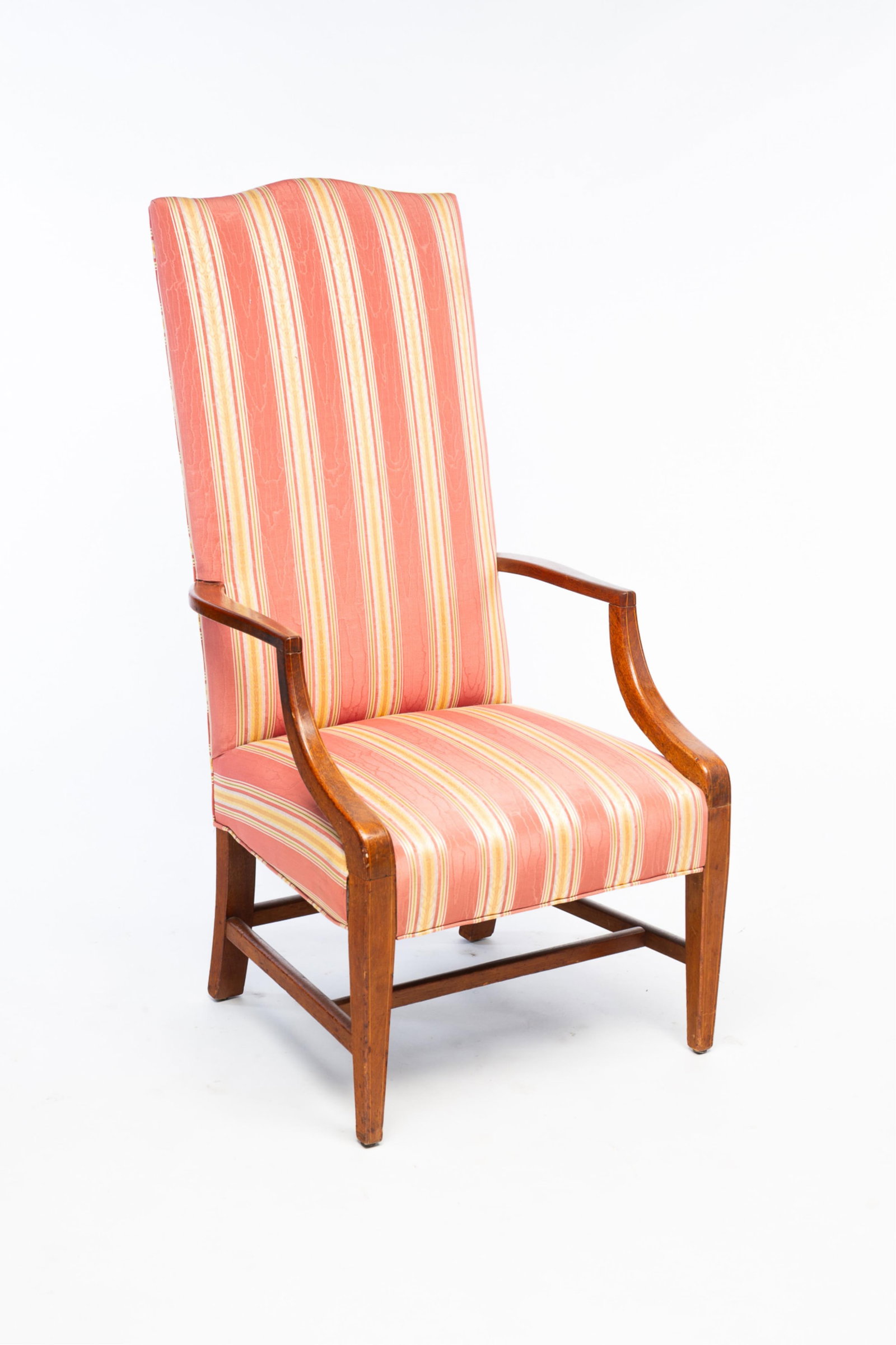 FEDERAL MAHOGANY LOLLING CHAIR.: American, Early 19th Century. Mahogany. Having a serpentine crest rail above a padded back and seat flanked by open arms. Rising on square, tapered legs joined by stretchers. 46.5"h. seat is 17"h. Pro