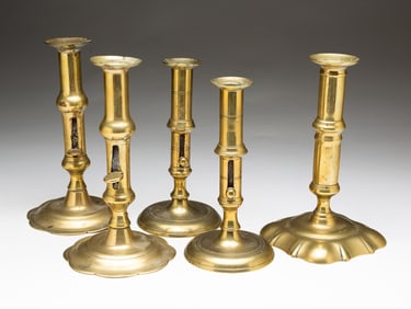 FIVE ENGLISH BRASS CANDLE STICKS. WITH PUSHUPS.