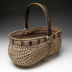AMERICAN BLACK AND WHITE-PAINTED BUTTOCKS BASKET.
