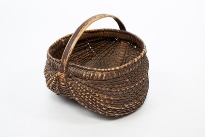 AMERICAN BROWN-PAINTED BUTTOCKS BASKET.
