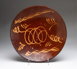 LARGE AMERICAN SLIP-DECORATED REDWARE CHARGER.
