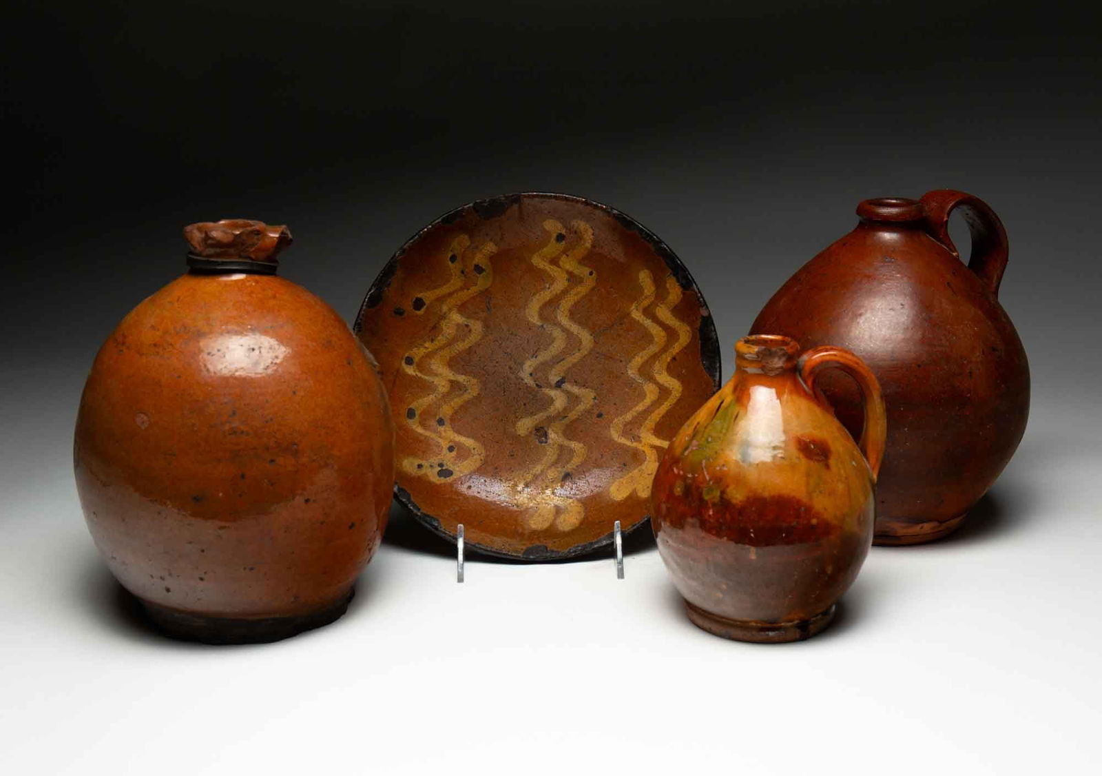FOUR AMERICAN REDWARE ITEMS. (1 of 6)