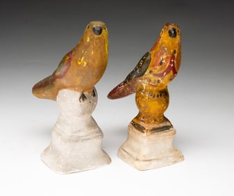 A NEAR PAIR OF PENNSYLVANIA CHALKWARE BIRDS.