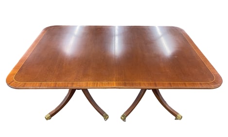 BAKER FURNITURE CLASSICAL STYLE MAHOGANY AND CROSSBANDED DOUBLE-PEDESTAL EXTENDING DINING TABLE.