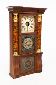 SETH THOMAS MAHOGANY AND PARCEL-GILT TRIPLE-DECKER MANTLE CLOCK WITH REVERSE-PAINTED GLASS.
