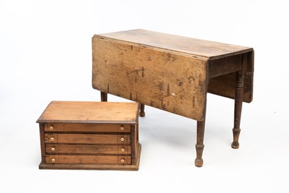 AMERICAN SHERATON WALNUT DROP-LEAF TABLE PLUS VICTORIAN FOUR-DRAWER SPOOL CABINET.