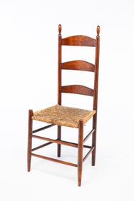AMERICAN RED-STAINED MAPLE LADDERBACK SIDE CHAIR.